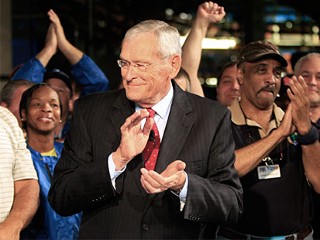 General Motors Co. CEO Edward Whitacre Jr., celebrates with workers during a news conference